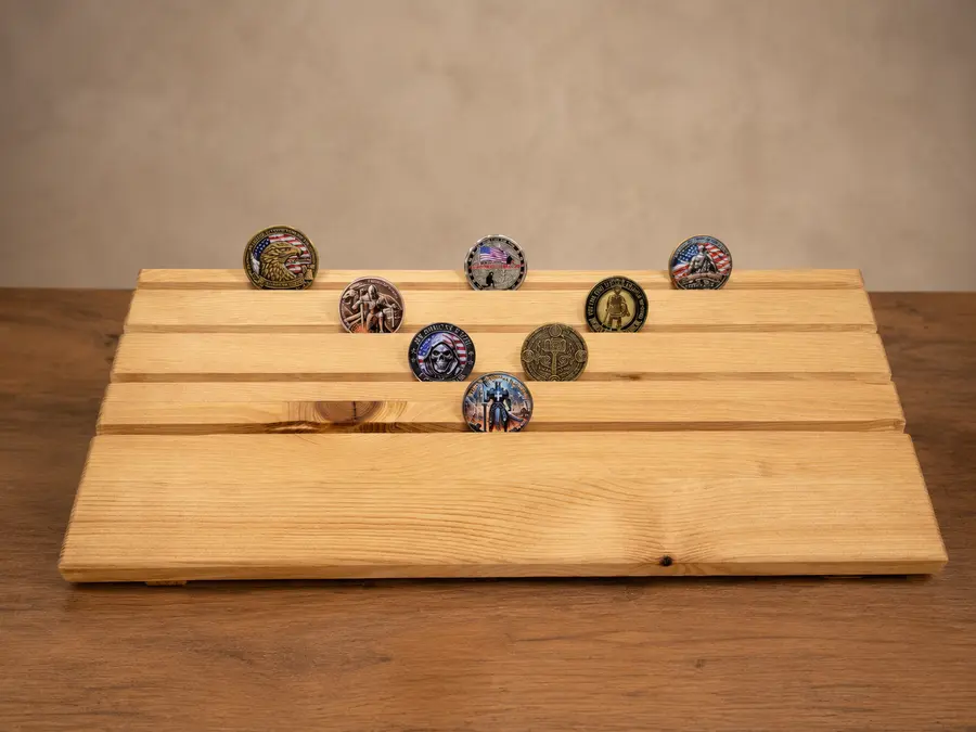 Handcrafted wooden challenge coin holder displaying eight sample coins